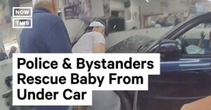 Baby wordt bevrijd nadat ze is aangereden en onder een auto terechtkomt